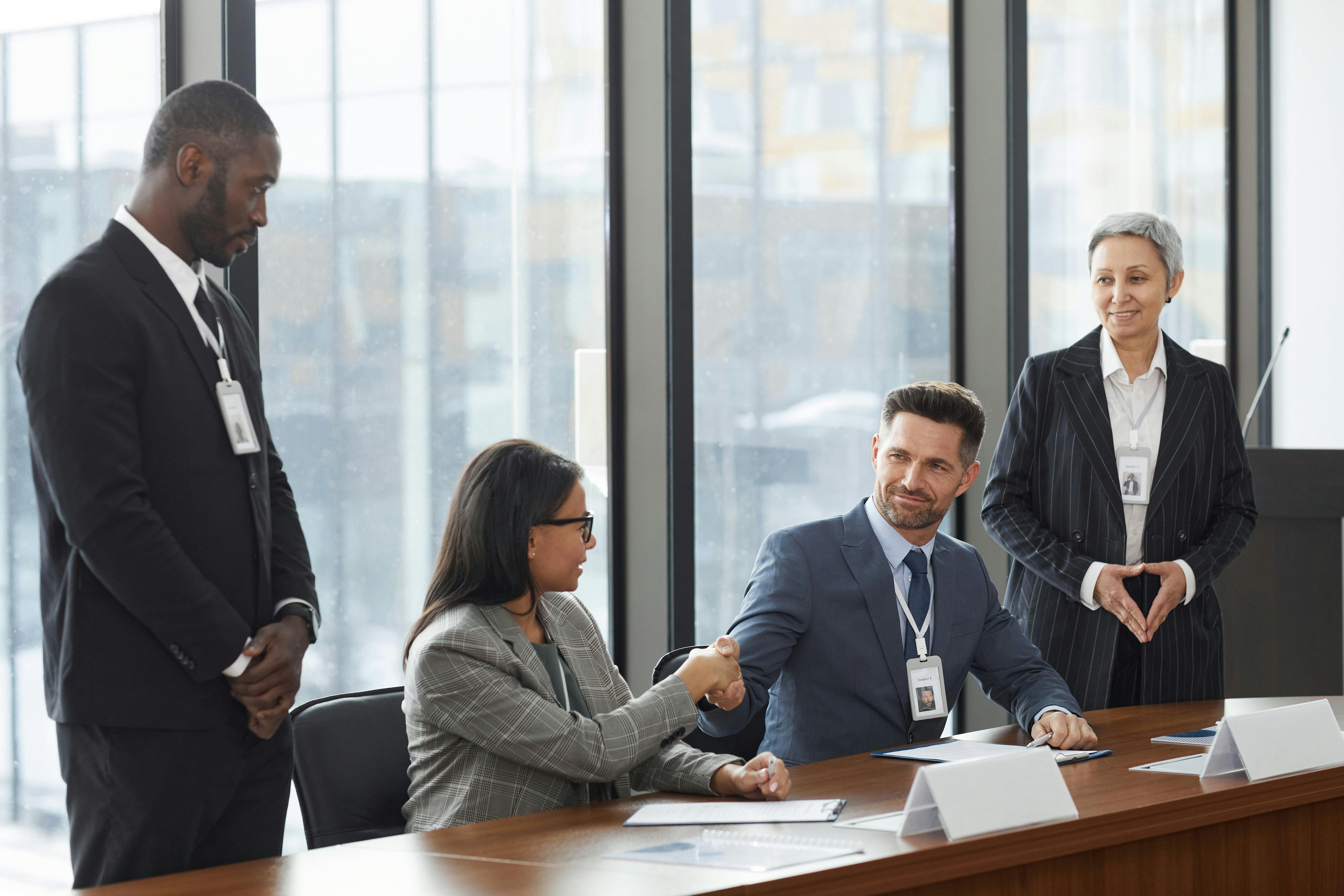 Professionals shaking hands in business agreement